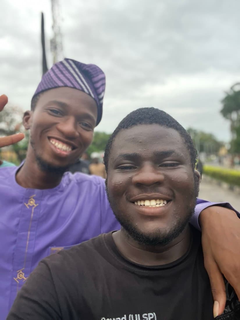 Two brothers smiling together in a selfie