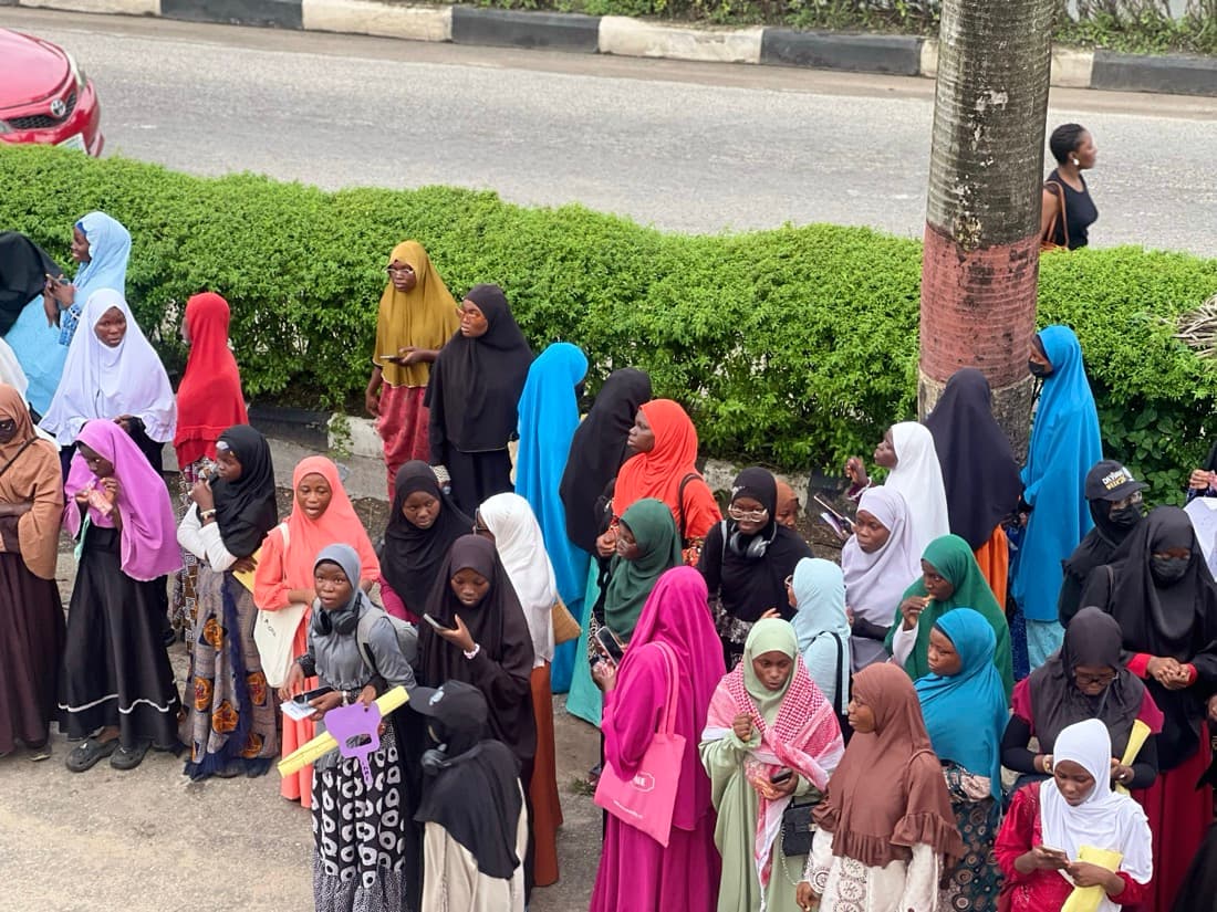 A large group of sisters standing together by the roadside