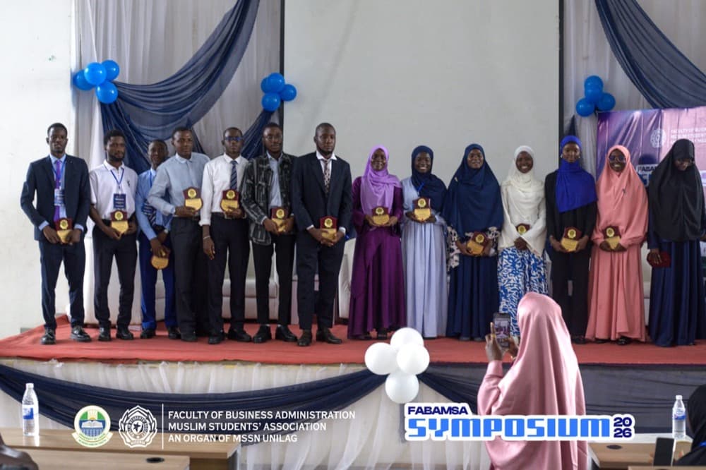 FABAMSA members lined up on stage at their Faculty Symposium