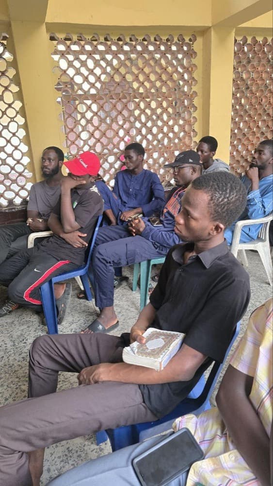 Brothers seated with their Qur'ans at a morning Tahfeez class